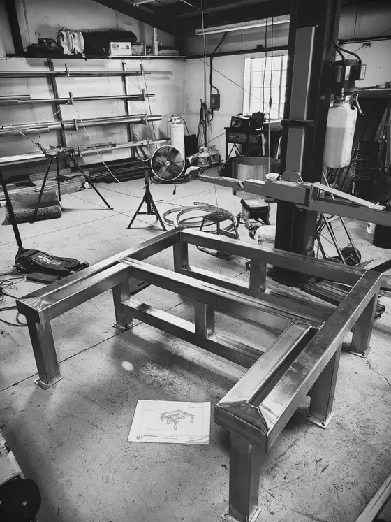 Custom stainless steel table frame under fabrication in the Wetzel Welding shop