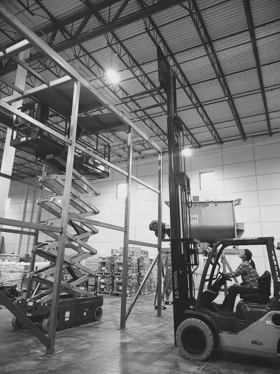Structural steel equipment platform built by Wetzel Welding with a forklift working on site